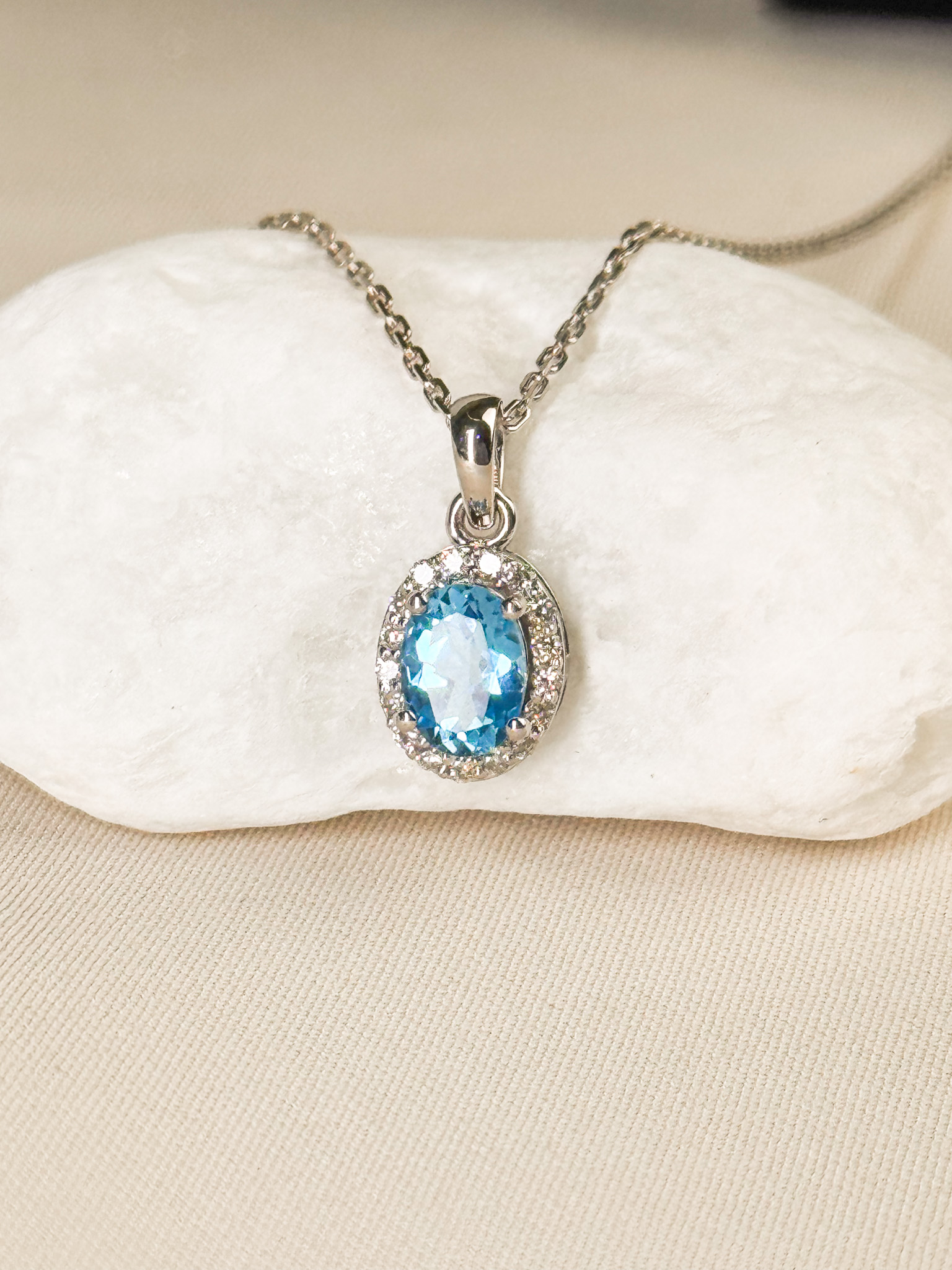 18k Oval-Cut Topaz Halo Pendant