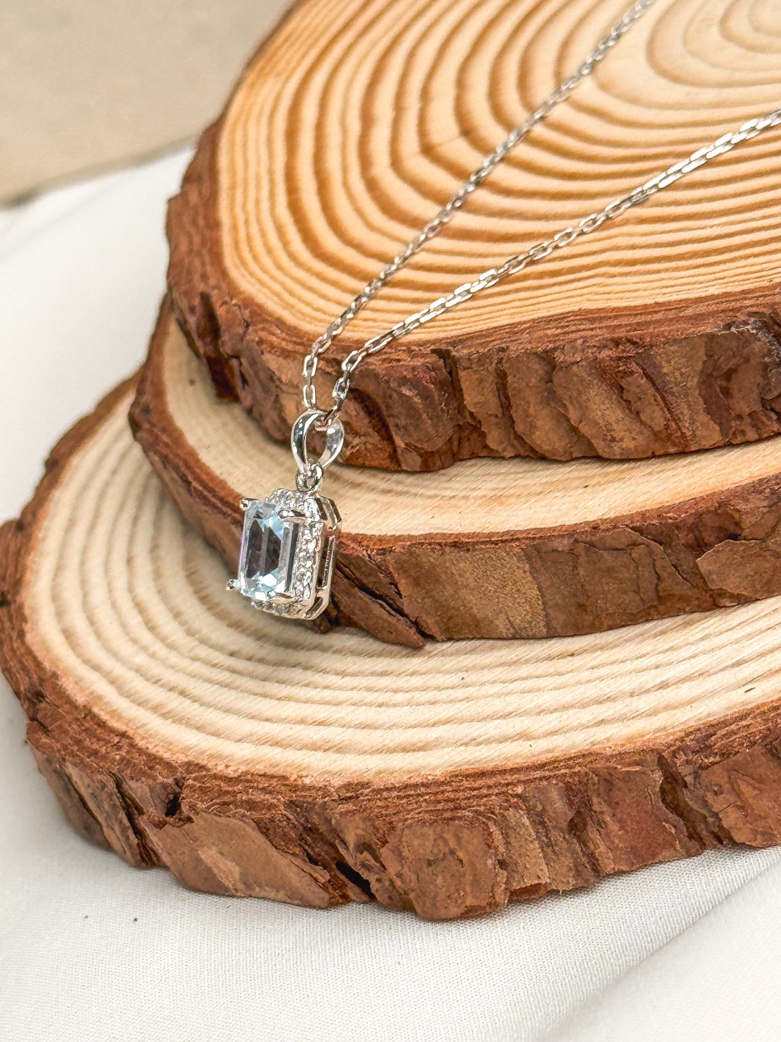18k Emerald-Cut Topaz Halo Pendant