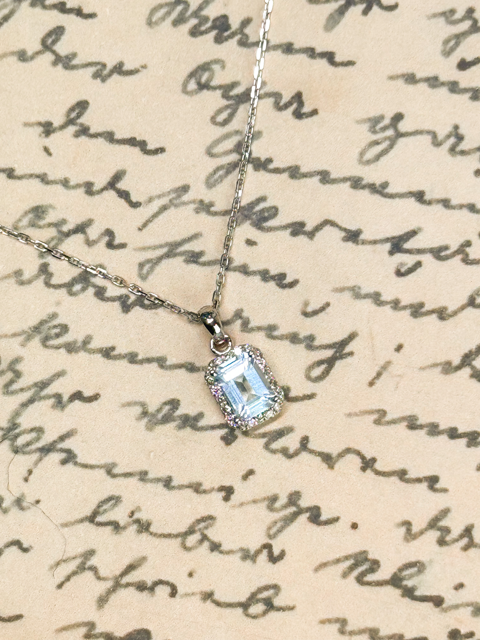 18k Emerald-Cut Topaz Halo Pendant