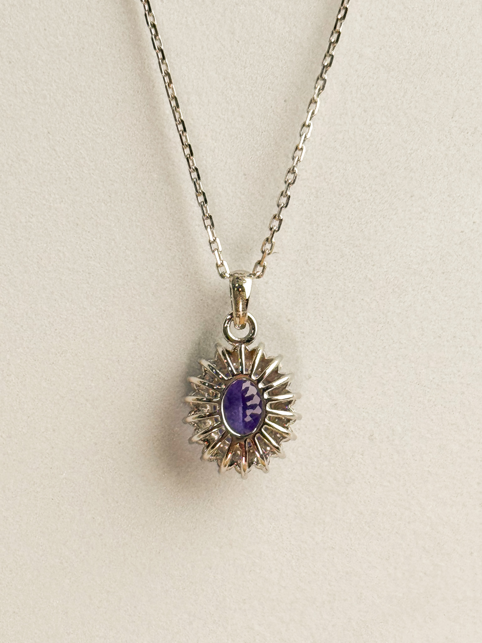 18k Oval-Cut Tanzanite Sunshine Halo Pendant